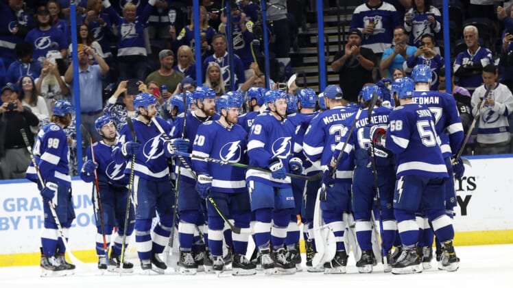 May 26, 2021; Tampa, Florida, USA;Tampa Bay Lightning right wing Barclay Goodrow (19) and teammates  celebrate as they beat the Florida Panthers during game six of the first round of the 2021 Stanley Cup Playoffs at Amalie Arena. Mandatory Credit: Kim Klement-USA TODAY Sports