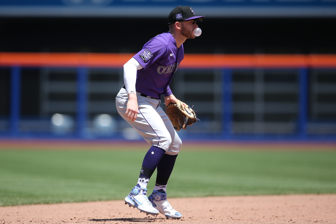 May 27, 2021; New York City, New York, USA; Colorado Rockies shortstop Trevor Story (27)  blows a bubblegum bubble while fielding his position during the fifth inning against the New York Mets at Citi Field. Mandatory Credit: Brad Penner-USA TODAY Sports