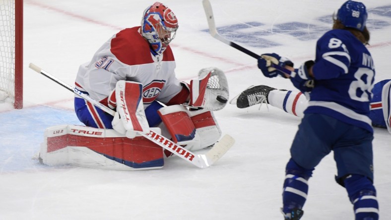 May 27, 2021; Toronto, Ontario, CAN;  Montreal Canadiens goalie Carey Price (31) saves a shot from Toronto Maple Leafs forward William Nylander (88) in game five of the first round of the 2021 Stanley Cup Playoffs at Scotiabank Arena. Mandatory Credit: Dan Hamilton-USA TODAY Sports