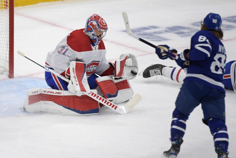 May 27, 2021; Toronto, Ontario, CAN;  Montreal Canadiens goalie Carey Price (31) saves a shot from Toronto Maple Leafs forward William Nylander (88) in game five of the first round of the 2021 Stanley Cup Playoffs at Scotiabank Arena. Mandatory Credit: Dan Hamilton-USA TODAY Sports