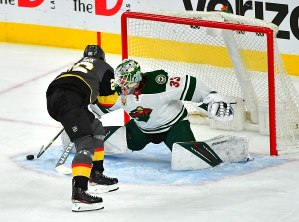 May 28, 2021; Las Vegas, Nevada, USA; Vegas Golden Knights center Mattias Janmark (26) scores a first period goal against Minnesota Wild goaltender Cam Talbot (33) in game seven of the first round of the 2021 Stanley Cup Playoffs at T-Mobile Arena. Mandatory Credit: Stephen R. Sylvanie-USA TODAY Sports