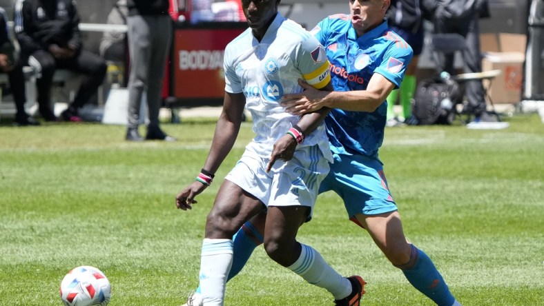 May 29, 2021; Chicago, Illinois, USA; Chicago Fire midfielder Luka Stojanovic (8) battles for the ball against Chicago Fire defender Boris Sekulic (2) during the first half at Soldier Field. Mandatory Credit: Mike Dinovo-USA TODAY Sports