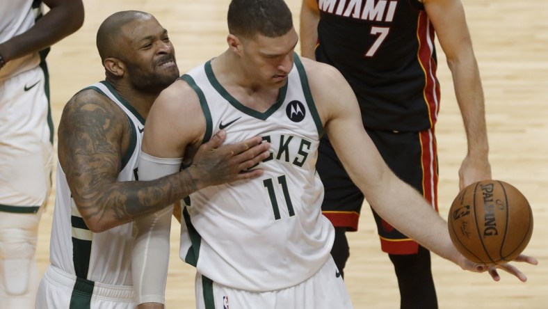 May 29, 2021; Miami, Florida, USA; Milwaukee Bucks forward P.J. Tucker (17) celebrates with center Brook Lopez (11) after scoring against the Miami Heat during the fourth quarter of game four in the first round of the 2021 NBA Playoffs at American Airlines Arena. Mandatory Credit: Sam Navarro-USA TODAY Sports