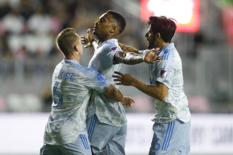 May 29, 2021; Fort Lauderdale, FL, Fort Lauderdale, FL, USA; D.C. United forward Ola Kamara (9) celebrates with midfielder Russell Canouse (6) and forward Adrien Perez (16) after scoring a goal against Inter Miami CF during the first half at DRV PKN Stadium. Mandatory Credit: Sam Navarro-USA TODAY Sports