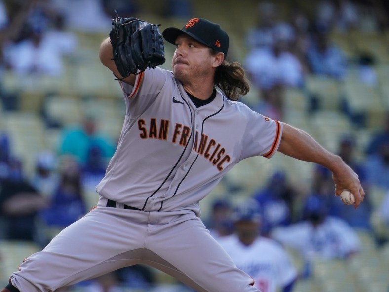 May 29, 2021; Los Angeles, California, USA; San Francisco Giants relief pitcher Scott Kazmir (16) throws a pitch in the sixth inning against the Los Angeles Dodgers at Dodger Stadium. Mandatory Credit: Robert Hanashiro-USA TODAY Sports