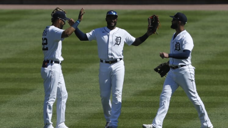 May 30, 2021; Detroit, Michigan, USA; (Left to right) Detroit Tigers left fielder Victor Reyes (22) center fielder Niko Goodrum (28) and right fielder Nomar Mazara (15) celebrate together after the game against the New York Yankees at Comerica Park. Mandatory Credit: Raj Mehta-USA TODAY Sports