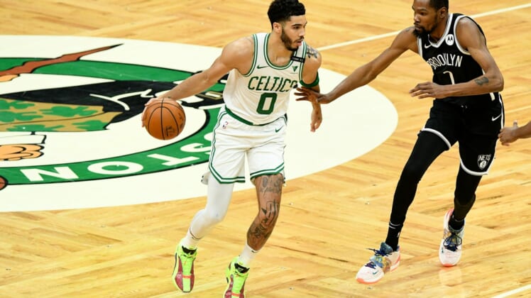 May 30, 2021; Boston, Massachusetts, USA; Boston Celtics forward Jayson Tatum (0) controls the ball in front of Brooklyn Nets forward Kevin Durant (7) during the first half of game four in the first round of the 2021 NBA Playoffs. at TD Garden. Mandatory Credit: Brian Fluharty-USA TODAY Sports