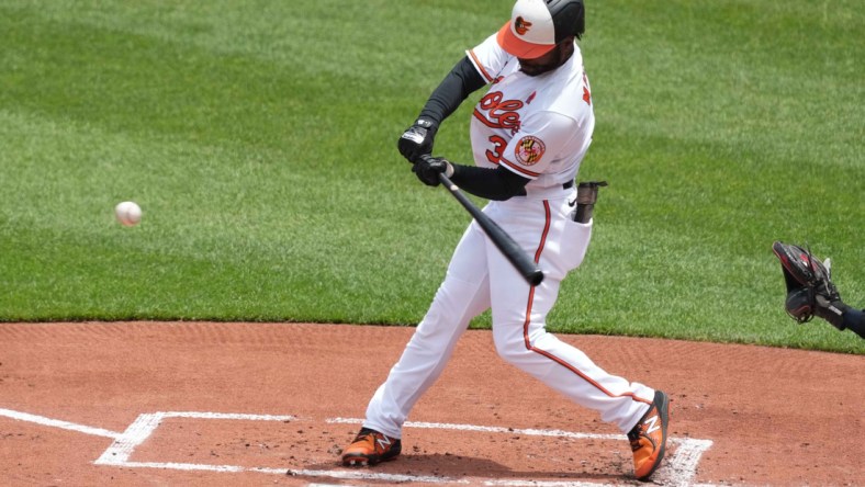 May 31, 2021; Baltimore, Maryland, USA; Baltimore Orioles outfielder Cedric Mullins (31) connects on a first inning double against the Minnesota Twins at Oriole Park at Camden Yards. Mandatory Credit: Mitch Stringer-USA TODAY Sports