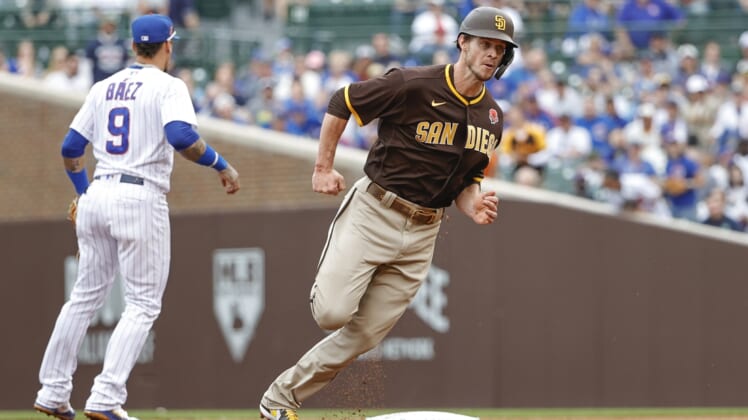 May 31, 2021; Chicago, Illinois, USA; San Diego Padres right fielder Wil Myers (5) runs to third base on a single hit by San Diego Padres left fielder Jurickson Profar (not pictured) against the Chicago Cubs during the second inning at Wrigley Field. Mandatory Credit: Kamil Krzaczynski-USA TODAY Sports