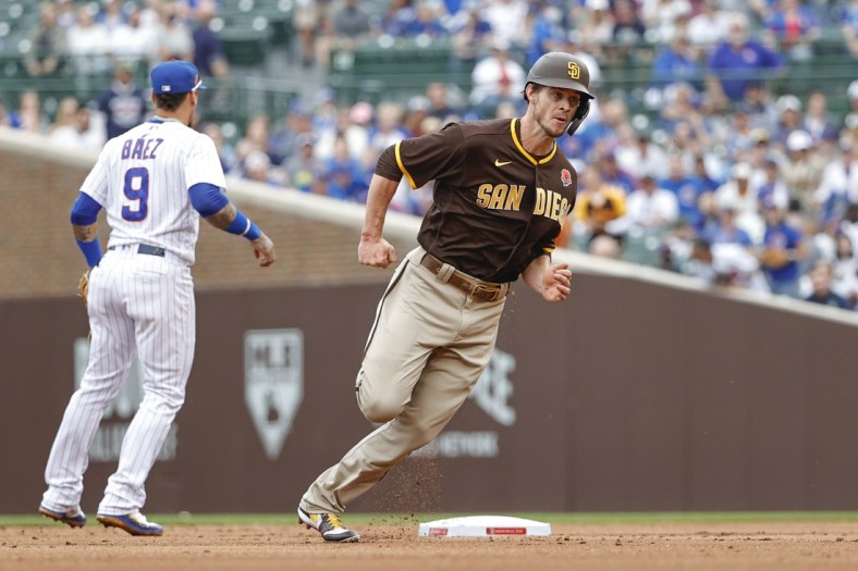 May 31, 2021; Chicago, Illinois, USA; San Diego Padres right fielder Wil Myers (5) runs to third base on a single hit by San Diego Padres left fielder Jurickson Profar (not pictured) against the Chicago Cubs during the second inning at Wrigley Field. Mandatory Credit: Kamil Krzaczynski-USA TODAY Sports