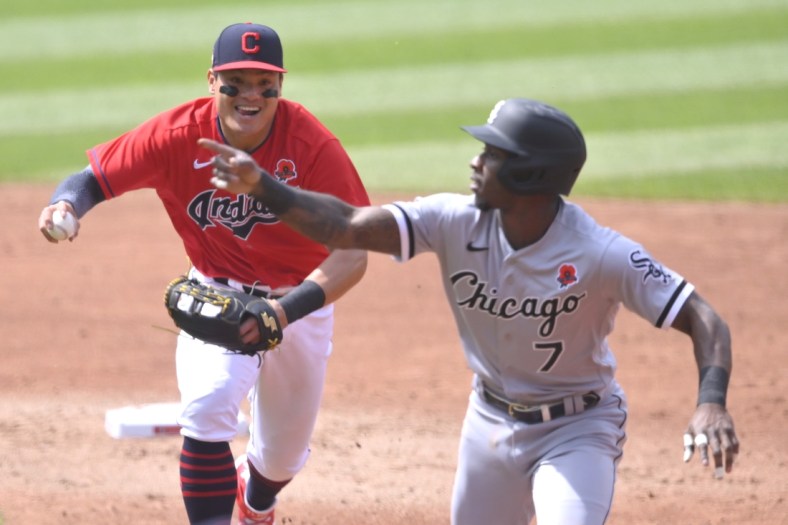 May 31, 2021; Cleveland, Ohio, USA; Chicago White Sox shortstop Tim Anderson (7) reacts as he is chased by Cleveland Indians shortstop Yu Chang (2) during a rundown in the second inning at Progressive Field. Mandatory Credit: David Richard-USA TODAY Sports