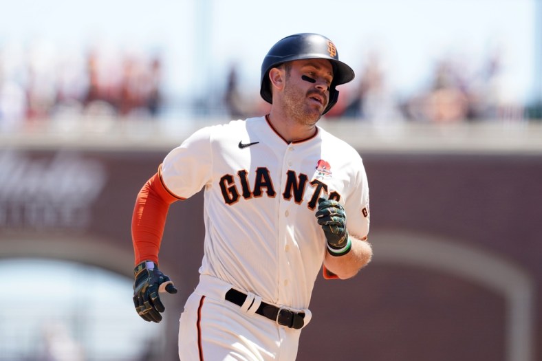 May 31, 2021; San Francisco, California, USA; San Francisco Giants infielder Evan Longoria (10) jogs towards home plate after hitting a home run against the Los Angeles Angels in the fourth inning at Oracle Park. Mandatory Credit: Cary Edmondson-USA TODAY Sports