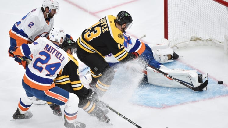 May 31, 2021; Boston, Massachusetts, USA; Boston Bruins center Charlie Coyle (13) scores a goal past New York Islanders goaltender Semyon Varlamov (40) during the first period in game two of the second round of the 2021 Stanley Cup Playoffs at TD Garden. Mandatory Credit: Bob DeChiara-USA TODAY Sports