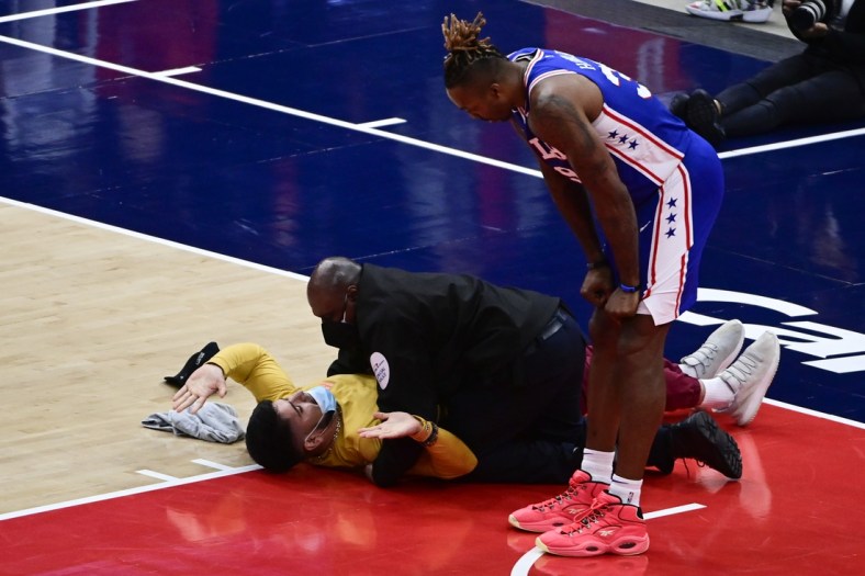 May 31, 2021; Washington, District of Columbia, USA; Philadelphia 76ers center Dwight Howard (39) looks on as security tackles a spectator on the court in the second half against the Washington Wizards during game four in the first round of the 2021 NBA Playoffs. at Capital One Arena. Mandatory Credit: Tommy Gilligan-USA TODAY Sports