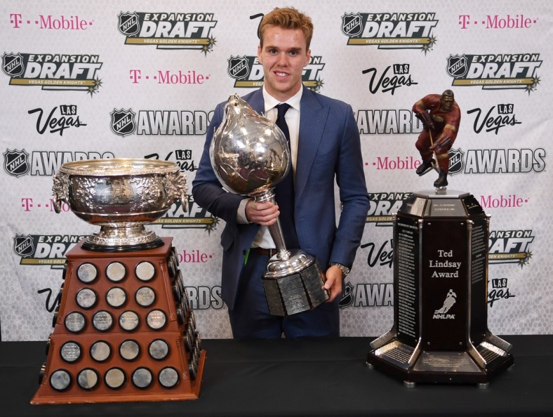 Jun 21, 2017; Las Vegas, NV, USA; Edmonton Oilers forward Connor McDavid poses for a photo with the Art Ross Trophy, Hart Trophy and Ted Lindsay Award in the interview room during the 2017 NHL Awards and Expansion Draft at T-Mobile Arena. Mandatory Credit: Stephen R. Sylvanie-USA TODAY Sports