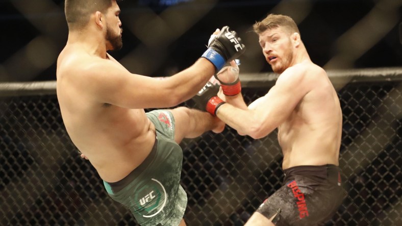 Nov 25, 2017; Shanghai, China; Kelvin Gastelum (blue gloves) fights Michael Bisping (red gloves) during UFC Fight Night at Mercedes-Benz Arena. Mandatory Credit: David G. McIntyre-USA TODAY Sports