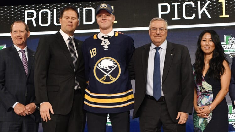 Jun 22, 2018; Dallas, TX, USA; Rasmus Dahlin poses for a photo with team executives after being selected as the number one overall pick to the Buffalo Sabres in the first round of the 2018 NHL Draft at American Airlines Center. Mandatory Credit: Jerome Miron-USA TODAY Sports