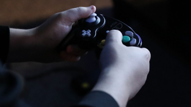 The hands of an esport gamer clutching the controler at Encore Esports Gaming Lounge in New Rochelle on Thursday, December 20, 2018. 

E Sports