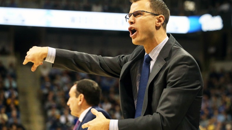 Jan 22, 2019; Pittsburgh, PA, USA;  Duke Blue Devils associate head coach Jon Scheyer reacts on the bench against the Pittsburgh Panthers during the first half at the Petersen Events Center. Duke won 79-64. Mandatory Credit: Charles LeClaire-USA TODAY Sports