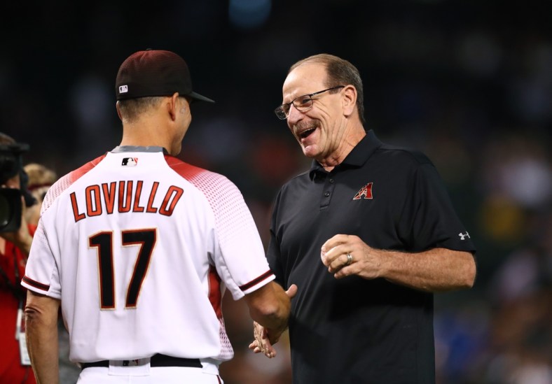 May 1, 2019; Phoenix, AZ, USA; Arizona Diamondbacks manager Torey Lovullo (left) shakes hands with former manager Bob Brenly after throwing out the first pitch prior to the game against the New York Yankees at Chase Field. Mandatory Credit: Mark J. Rebilas-USA TODAY Sports
