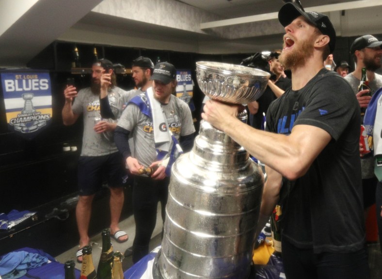 Jun 12, 2019; Boston, MA, USA; St. Louis Blues defenseman Carl Gunnarsson celebrates in the locker room after defeating the Boston Bruins in game seven of the 2019 Stanley Cup Final at TD Garden. Mandatory Credit: Dave Sandford/Pool Photo via USA TODAY Sports