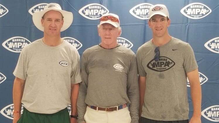 Left to right: Peyton Manning, Archie Manning and Eli Manning pose at the 24th Annual Manning Passing Academy on June 28, 2019.Archie Manning Eli Peyton MPA 2019
