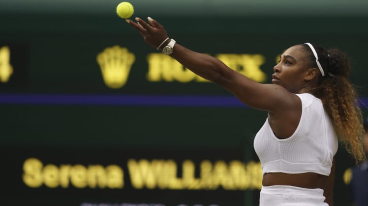 Jul 13, 2019; London, United Kingdom; Serena Williams (USA) serves during a match against Simona Halep (ROU) on day 12 at the All England Lawn and Croquet Club. Mandatory Credit: Susan Mullane-USA TODAY Sports
