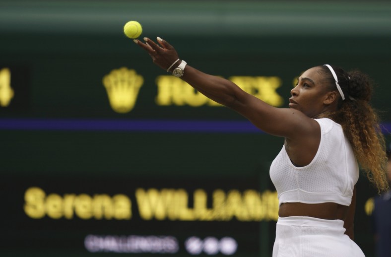 Jul 13, 2019; London, United Kingdom; Serena Williams (USA) serves during a match against Simona Halep (ROU) on day 12 at the All England Lawn and Croquet Club. Mandatory Credit: Susan Mullane-USA TODAY Sports
