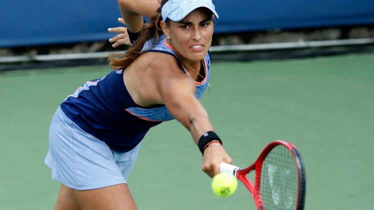 Monica Puig returns a shot in the second set during the Western & Southern Open match between Monica Puig and Yafan Wang at the Lindner Family Tennis Center in Mason, Ohio, on Tuesday, Aug. 13, 2019. Wang advanced with a 3-6, 7-5, 6-3 win.Monica Puig Vs Yafan Wang Western Southern Open