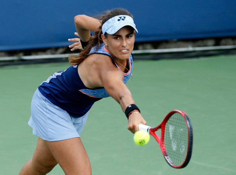 Monica Puig returns a shot in the second set during the Western & Southern Open match between Monica Puig and Yafan Wang at the Lindner Family Tennis Center in Mason, Ohio, on Tuesday, Aug. 13, 2019. Wang advanced with a 3-6, 7-5, 6-3 win. 

Monica Puig Vs Yafan Wang Western Southern Open