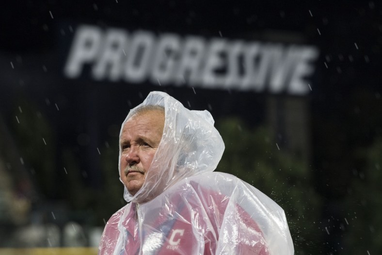Sep 13, 2019; Cleveland, OH, USA; A Cleveland Indians employee stands on the field during a rain delay in the third inning  of the game between the Cleveland Indians and the Minnesota Twins at Progressive Field. Mandatory Credit: Ken Blaze-USA TODAY Sports