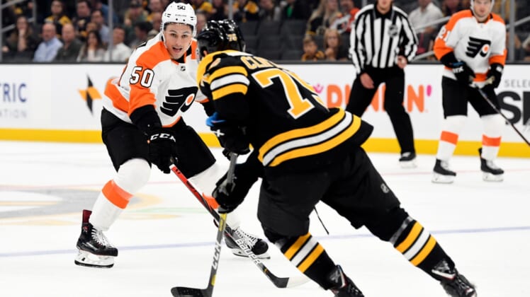 Sep 23, 2019; Boston, MA, USA; Philadelphia Flyers center German Rubtsov (50) defends Boston Bruins defenseman Connor Clifton (75) during the first period at TD Garden. Mandatory Credit: Brian Fluharty-USA TODAY Sports