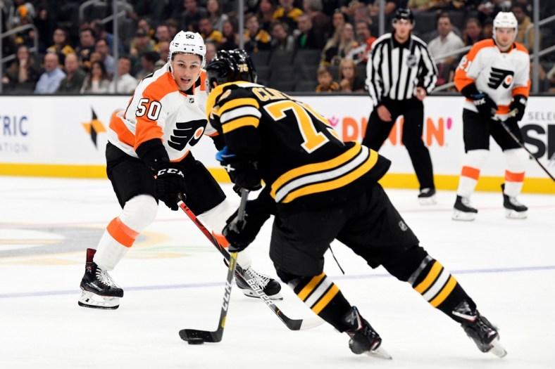 Sep 23, 2019; Boston, MA, USA; Philadelphia Flyers center German Rubtsov (50) defends Boston Bruins defenseman Connor Clifton (75) during the first period at TD Garden. Mandatory Credit: Brian Fluharty-USA TODAY Sports