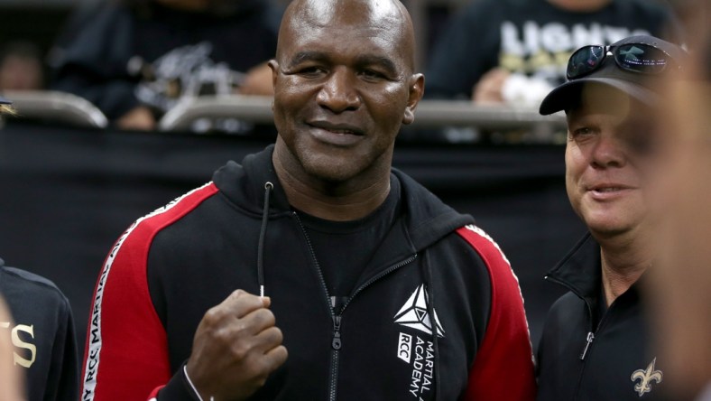 Nov 10, 2019; New Orleans, LA, USA; Former heavyweight boxing champion Evander Holyfield poses for pictures before a game between the New Orleans Saints and the Atlanta Falcons at the Mercedes-Benz Superdome. Mandatory Credit: Chuck Cook-USA TODAY Sports