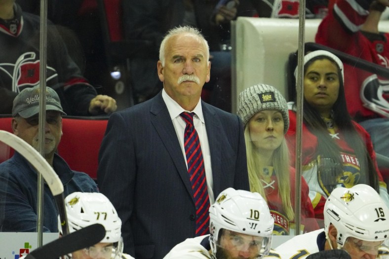 Dec 21, 2019; Raleigh, North Carolina, USA;  Florida Panthers head coach Joel Quenneville looks on from behind the players bench against the Carolina Hurricanes at PNC Arena. The Florida Panthers defeated the Carolina Hurricanes 4-2. Mandatory Credit: James Guillory-USA TODAY Sports