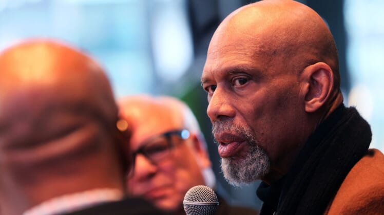 Kareem Abdul-Jabbar, right, talks with Grady Crosby, left, and Jim Paschke, center, at the "Diversity and Inclusion Conversation" at the MECCA Sports Bar and Grill.MJS-bucksdiversity29p3