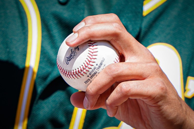 Jul 4, 2020; Oakland, California, United States; Detail view of Oakland Athletics pitcher Sean Manaea (55) gripping a baseball during summer camp at RingCentral Coliseum. Mandatory Credit: Stan Szeto-USA TODAY Sports