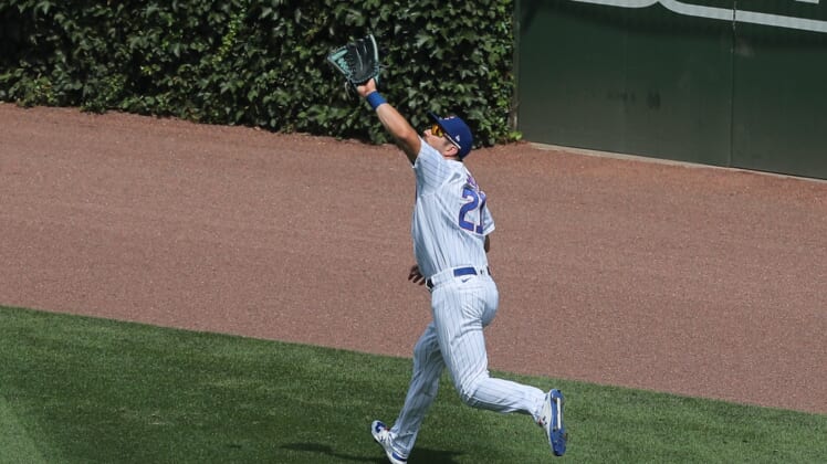 Aug 2, 2020; Chicago, Illinois, USA; Chicago Cubs right fielder Steven Souza Jr. (21) catches a fly ball off the bat of Pittsburgh Pirates first baseman Jose Osuna (not pictured) during the third inning against the Pittsburgh Pirates at Wrigley Field. Mandatory Credit: Dennis Wierzbicki-USA TODAY Sports