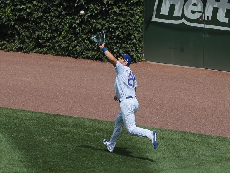 Aug 2, 2020; Chicago, Illinois, USA; Chicago Cubs right fielder Steven Souza Jr. (21) catches a fly ball off the bat of Pittsburgh Pirates first baseman Jose Osuna (not pictured) during the third inning against the Pittsburgh Pirates at Wrigley Field. Mandatory Credit: Dennis Wierzbicki-USA TODAY Sports