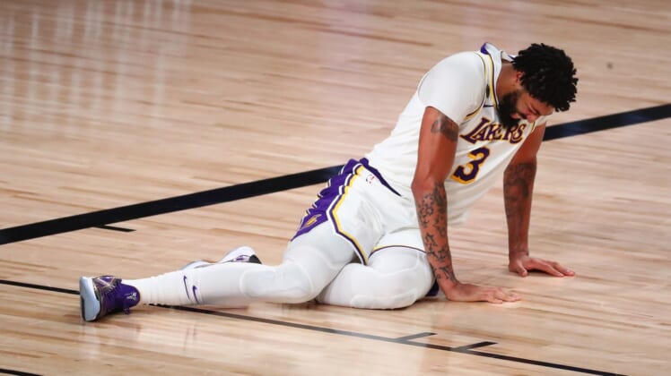 Sep 8, 2020; Lake Buena Vista, Florida, USA; Los Angeles Lakers forward Anthony Davis (3) lies on the floor after suffering an apparent injury with Houston Rockets forward Robert Covington (not picture) during the second half of game three in the second round of the 2020 NBA Playoffs at AdventHealth Arena. Mandatory Credit: Kim Klement-USA TODAY Sports