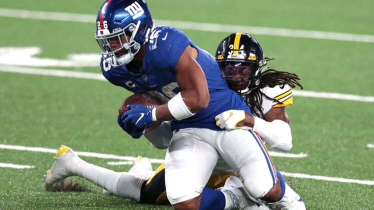 Sep 14, 2020; East Rutherford, New Jersey, USA; New York Giants running back Saquon Barkley (26) is tackled by Pittsburgh Steelers strong safety Terrell Edmunds (34) during the second half at MetLife Stadium. Mandatory Credit: Vincent Carchietta-USA TODAY Sports