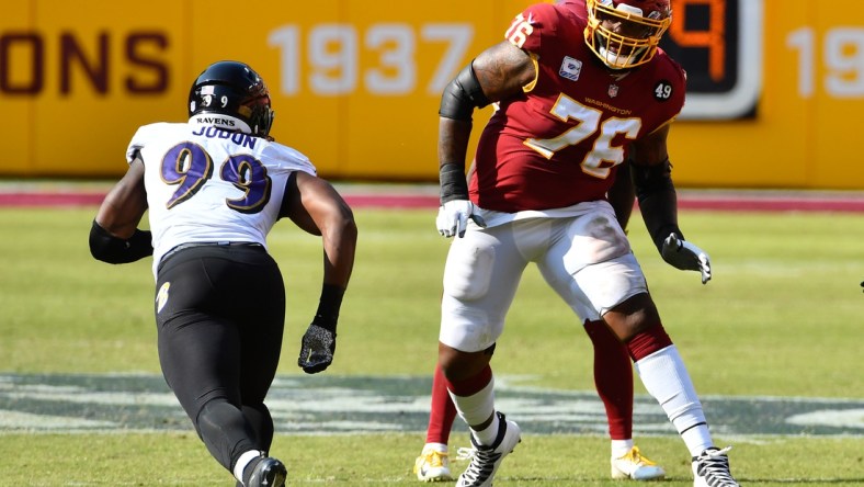 Oct 4, 2020; Landover, Maryland, USA; Washington Football Team offensive tackle Morgan Moses (76) prepares to block Baltimore Ravens outside linebacker Matt Judon (99) during the second half at FedExField. Mandatory Credit: Brad Mills-USA TODAY Sports