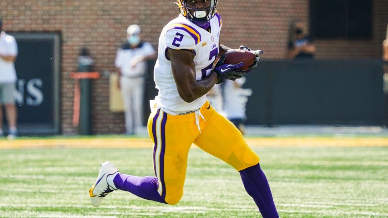 Oct 10, 2020; Columbia, Missouri, USA; LSU Tigers tight end Arik Gilbert (2) runs against the Missouri Tigers during the first half at Faurot Field at Memorial Stadium. Mandatory Credit: Jay Biggerstaff-USA TODAY Sports