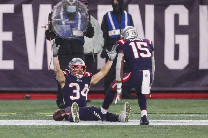 Nov 15, 2020; Foxborough, Massachusetts, USA; New England Patriots running back Rex Burkhead (34) celebrates after scoring a touchdown during the first half against the Baltimore Ravens at Gillette Stadium. Mandatory Credit: Paul Rutherford-USA TODAY Sports