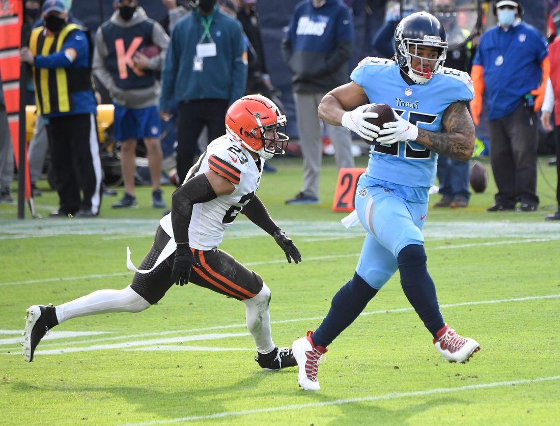 Tennessee Titans tight end MyCole Pruitt (85) rushes for a touchdown after a catch over Cleveland Browns free safety Andrew Sendejo (23) during the third quarter at Nissan Stadium Sunday, Dec. 6, 2020 in Nashville, Tenn.

Gw54480