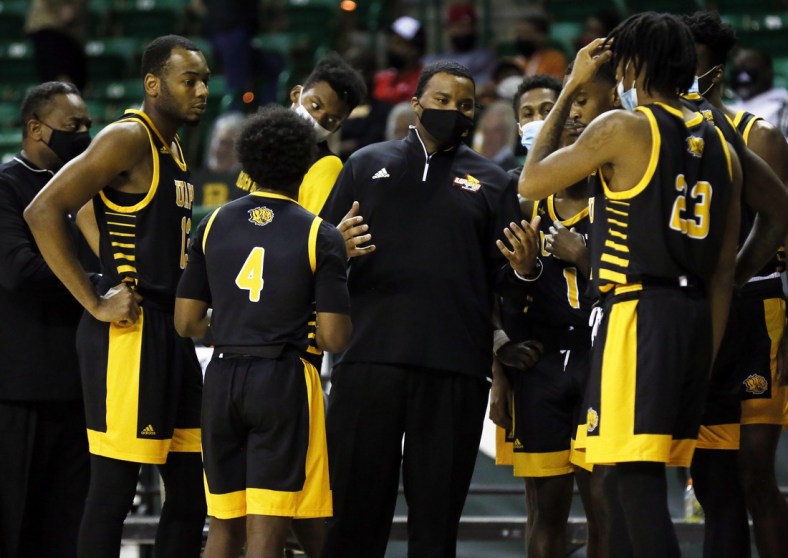 Dec 21, 2020; Waco, Texas, USA; Arkansas-Pine Bluff Golden Lions head coach George Ivory huddles with his team during the second half against the Baylor Bears at Ferrell Center. Mandatory Credit: Raymond Carlin III-USA TODAY Sports