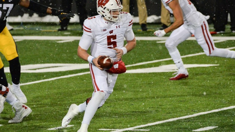 Dec 12, 2020; Iowa City, Iowa, USA; Wisconsin Badgers quarterback Graham Mertz (5) in action during the game against the Iowa Hawkeyes at Kinnick Stadium. Mandatory Credit: Jeffrey Becker-USA TODAY Sports