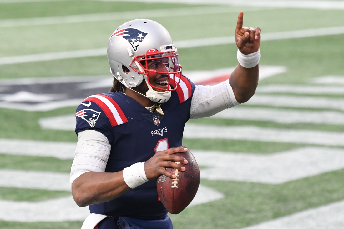 Jan 3, 2021; Foxborough, Massachusetts, USA; New England Patriots quarterback Cam Newton (1) celebrates after scoring a touchdown against the New York Jets during the third quarter at Gillette Stadium. Mandatory Credit: Brian Fluharty-USA TODAY Sports