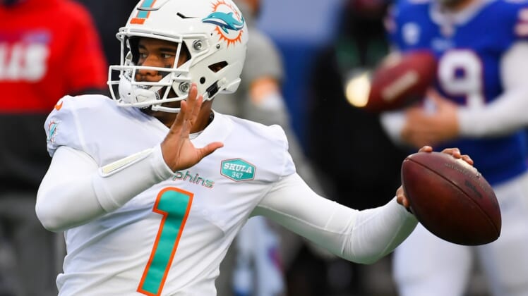 Jan 3, 2021; Orchard Park, New York, USA; Miami Dolphins quarterback Tua Tagovailoa (1) warms up prior to the game against the Buffalo Bills at Bills Stadium. Mandatory Credit: Rich Barnes-USA TODAY Sports