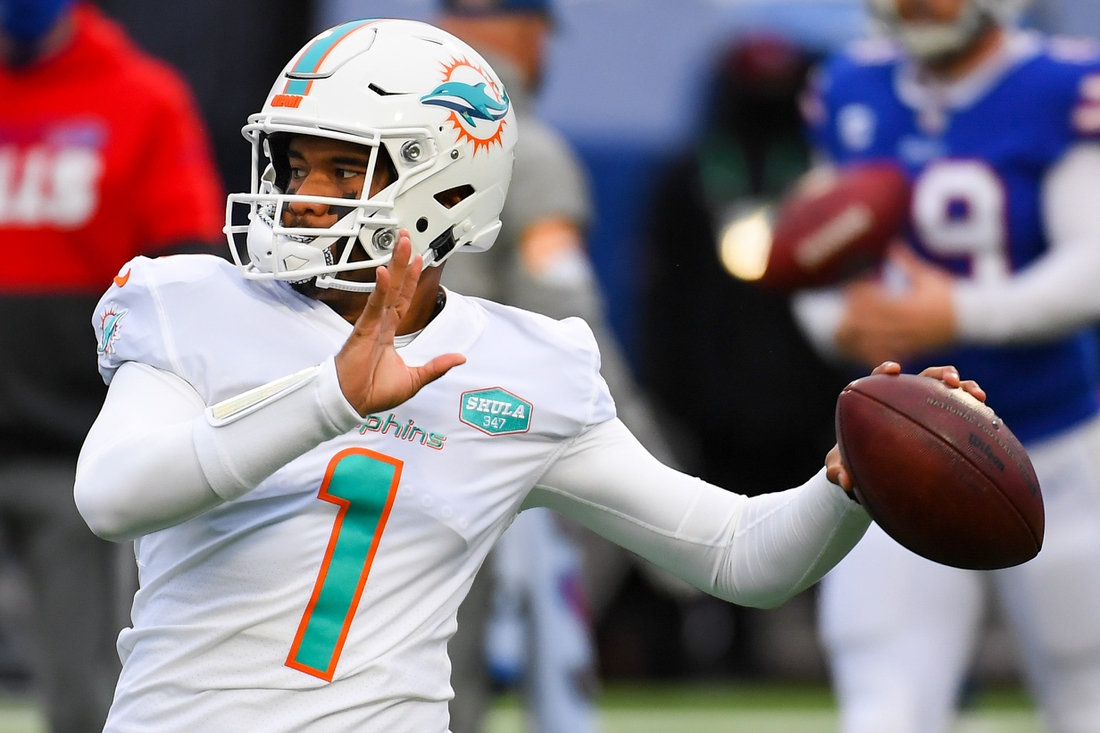 Jan 3, 2021; Orchard Park, New York, USA; Miami Dolphins quarterback Tua Tagovailoa (1) warms up prior to the game against the Buffalo Bills at Bills Stadium. Mandatory Credit: Rich Barnes-USA TODAY Sports